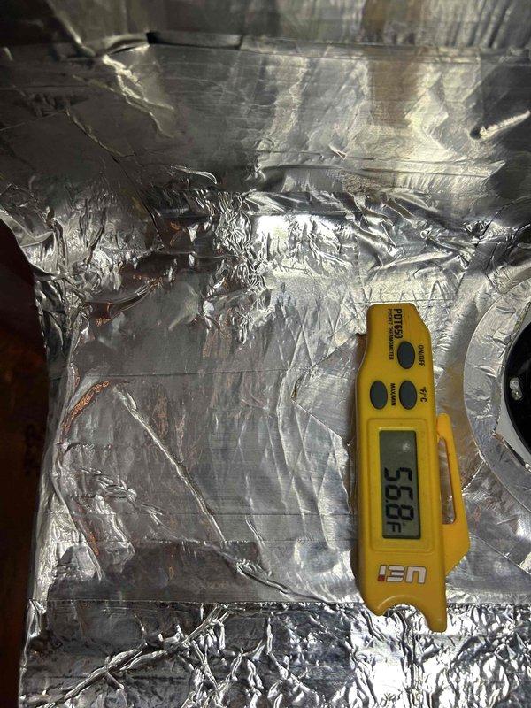 Responded to basement flooding incident affecting HVAC system. Performed comprehensive safety inspection of furnace unit that had been submerged and powered off as precautionary measure. Conducted visual assessment of equipment interior, checking for water damage, contamination, and potential mold growth. Measured internal temperature at 53.9°F and inspected reflective duct insulation for water intrusion and structural integrity. Documented water line marks approximately 14 inches high on insulation material, indicating flood depth. Evaluated foil-faced insulation for signs of moisture retention, degradation, and microbial growth concerns. Inspected electrical components, wiring, and connections for water exposure and corrosion. Unit remains de-energized pending further assessment and drying period. Recommend professional water damage remediation, thorough drying of all components, and follow-up inspection before restoration of service to ensure safe operation.