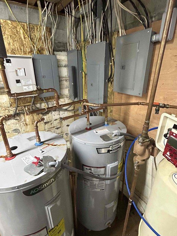Responded to emergency call for leaking A.O. Smith water heater (serial #2229130323637) experiencing severe overflow from top of unit. Upon arrival, confirmed active leak flooding from upper portion of tank, requiring homeowner to shut off main water supply to entire property. Diagnosed failed water heater tank requiring complete unit replacement under manufacturer warranty through Lowe's/A.O. Smith. Disconnected all copper supply and discharge piping, electrical connections, and pressure relief valve from failed unit. Removed defective water heater from basement mechanical room. Obtained replacement water heater from Lowe's using Return Authorization #R14862859 for warranty exchange. Installed new A.O. Smith water heater, reconnecting all copper plumbing lines, valves, electrical supply, and pressure relief valve per manufacturer specifications and local plumbing code. Tested all connections for leaks, verified proper electrical operation, and restored full water service to property i
