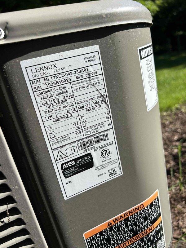 Responded to service call for HVAC system running continuously with thermostat displaying "waiting for equipment" message in auto mode. Accessed outdoor Lennox ML17XC1S condensing unit via deck hatch to perform diagnostic evaluation. Documented equipment specifications and current system operation, photographed unit nameplate showing R-454B refrigerant system manufactured February 2025. Troubleshot communication issue between thermostat and outdoor unit causing improper cycling behavior.