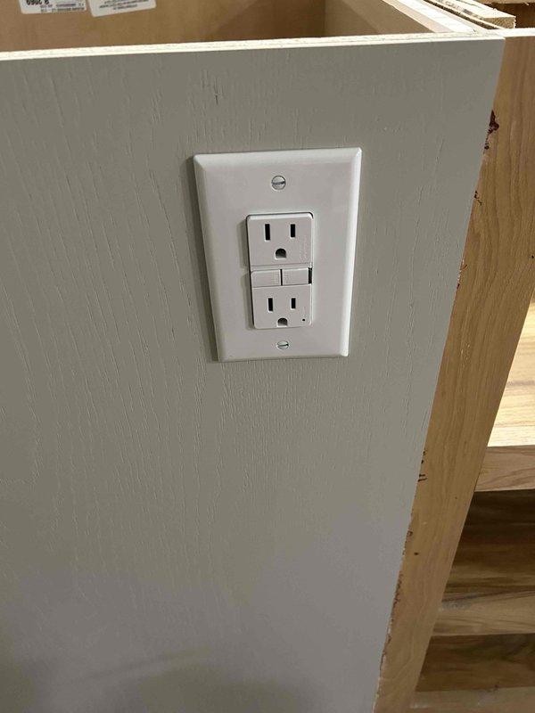 Completed rough-in electrical work for kitchen remodel, installing new branch circuits using 12/2, 12/3, 14/2, and 14/3 Romex wiring as required for appliance and general lighting circuits. Installed GFCI receptacles and standard duplex outlets in accordance with NEC requirements, with finish work including device installation and cover plate mounting in renovated areas.