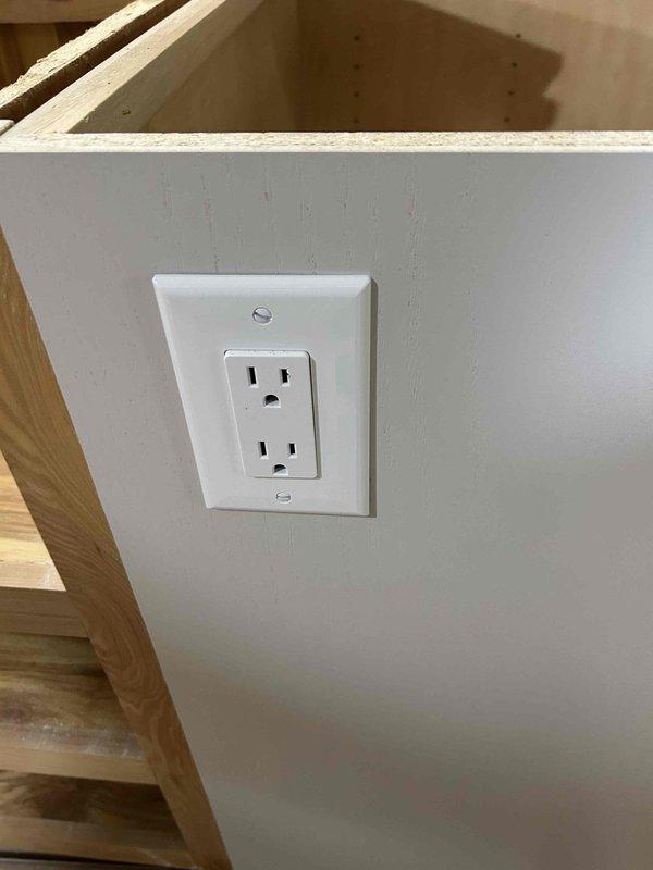 Completed rough-in electrical work for kitchen remodel, installing new branch circuits using 12/2, 12/3, 14/2, and 14/3 Romex wiring as required for appliance and general lighting circuits. Installed GFCI receptacles and standard duplex outlets in accordance with NEC requirements, with finish work including device installation and cover plate mounting in renovated areas.