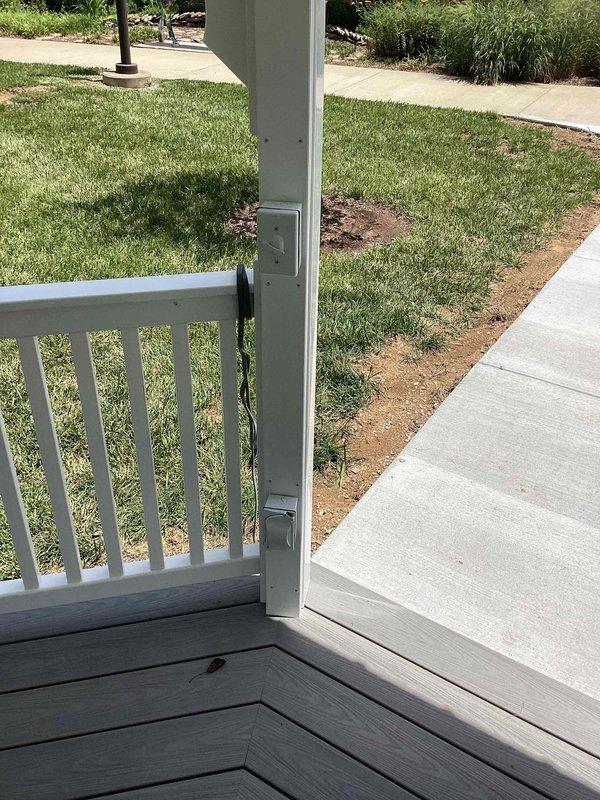 Successfully installed white outdoor-rated ceiling fan with integrated light kit in gazebo structure. Completed all electrical connections, mounted unit to central hub of octagonal ceiling, and verified proper operation of both fan motor and lighting fixture with pull chain controls.