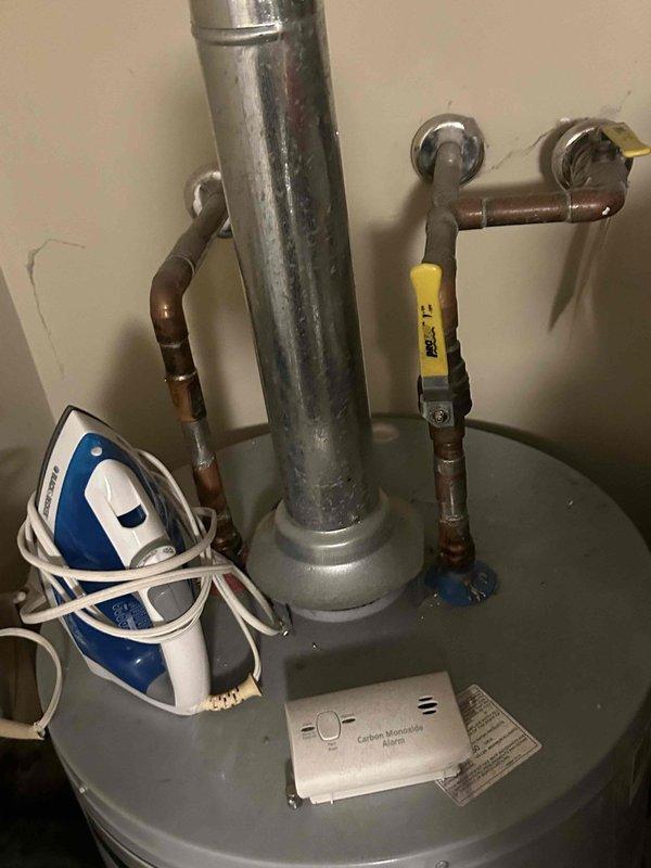 Completed routine plumbing maintenance inspection of residential property. Inspected under-sink plumbing including garbage disposal unit, P-trap configuration, and PVC drainage system, confirming all components are properly connected and functioning without visible leaks. Examined water heater unit, supply lines, shut-off valves, and pressure relief valve assembly, verifying all connections are secure and system is operating within normal parameters.