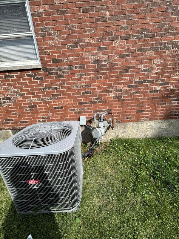Completed full HVAC system replacement installing Bryant 2-ton 14.3 SEER2 single-stage air conditioning unit (model GA5SAN52400W) with matching Bryant 2-ton evaporator coil (model CVAMA2417XMA) and condensate pump. Removed and properly disposed of existing equipment, then installed new outdoor condensing unit on existing pad utilizing existing disconnect box. Fabricated and installed new supply and return plenums, ran 6-inch supply ductwork, hung and sealed existing supply runs, and added additional floor return at customer-specified location per custom ductwork modifications. Connected refrigerant lines with copper piping, performed vacuum test, and charged system with R454B refrigerant to manufacturer specifications. Verified system operation with digital manifold gauges confirming proper superheat and subcooling temperatures, with readings showing system operating within normal parameters. Retained existing thermostat and integrated with new equipment. Obtained all applicable permit