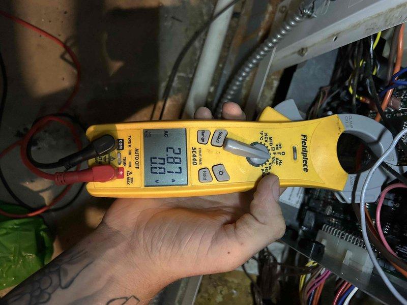 Completed comprehensive maintenance tune-up on geothermal split system with indoor units located in basement and attic. Performed diagnostic testing including temperature differential measurements reading 45.1 degrees and electrical current analysis on system components, verifying proper operation of both zones and confirming all electrical connections and refrigerant circuits are functioning within manufacturer specifications.