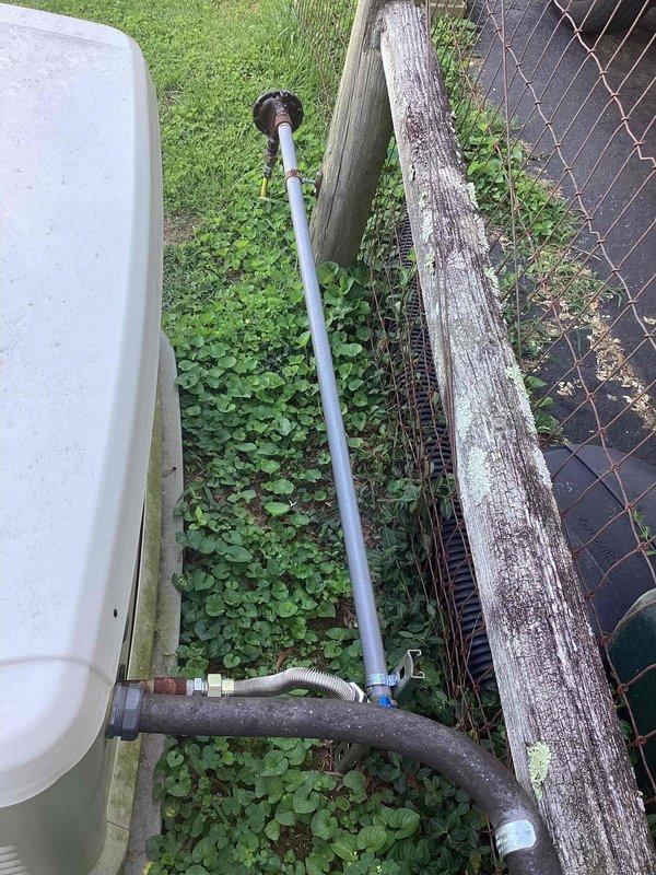 Responded to service call for Generac whole-house generator displaying red indicator light that had previously shown green status. Upon arrival, performed comprehensive diagnostic evaluation of the generator system and associated electrical components. Inspected the generator control panel, verified all electrical connections at the exterior-mounted Generac transfer switch and metering equipment, and assessed the overall installation integrity. Checked generator battery voltage, control board status indicators, and examined all visible wiring conduits for damage or loose connections. Evaluated the fuel supply system and confirmed proper grounding of the unit. Documented current system status with photographic evidence showing the exterior electrical installation including the transfer switch mounted on brick exterior wall and associated utility connections. Provided customer with diagnostic findings and recommended next steps for restoring generator to normal operational status with gr