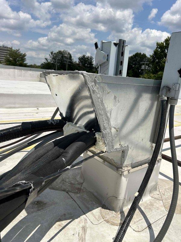 Completed repair of damaged metal housing cover on rooftop unit #1. Fabricated and installed replacement panel using two sheets of double-wall material with S-lock seam construction to restore proper equipment enclosure. Work required 1.5 man-hours to remove compromised cover exhibiting heat damage and discoloration, measure and cut new material to specifications, and secure replacement panel with appropriate fasteners and sealing to protect internal components from weather exposure.