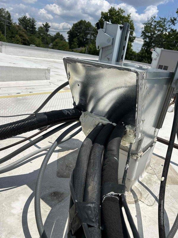 Completed repair of damaged metal housing cover on rooftop unit #1. Fabricated and installed replacement panel using two sheets of double-wall material with S-lock seam construction to restore proper equipment enclosure. Work required 1.5 man-hours to remove compromised cover exhibiting heat damage and discoloration, measure and cut new material to specifications, and secure replacement panel with appropriate fasteners and sealing to protect internal components from weather exposure.