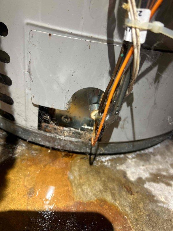Responded to non-urgent service call for non-operational air conditioning system in guest house. Upon inspection, discovered severe corrosion and rust accumulation at base of existing HVAC unit, indicating prolonged moisture exposure and deterioration of critical components. Unit housing showed significant wear with corroded metal surfaces, damaged base pan, and compromised structural integrity. Wiring and internal components exhibited signs of age-related degradation. Given the extensive corrosion damage and compromised condition of the equipment, provided comprehensive replacement estimate for new HVAC system installation to restore cooling functionality to the guest house structure.