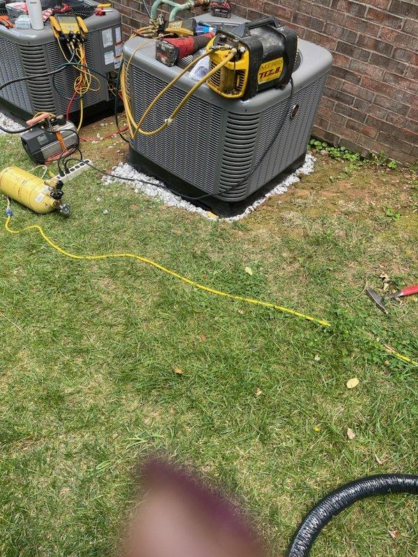 Completed full residential HVAC system installation for two-zone climate control. Second floor installation included RUUD RA14AY24BJ1NALHP 2-ton 15.2 SEER2 air conditioner, RCFY2414STAAMC evaporator coil, R801T0503A14UHSNAS 50,000 BTU 80% AFUE gas furnace, digital thermostat, and R8 foil duct insulation applied to both supply and return plenums. First floor/basement installation included RUUD RA14AY24BJ1NALHP 2-ton 15.2 SEER2 air conditioner, RCFY2417STANMC evaporator coil, R801T0754A17UHSNAS 75,000 BTU 80% AFUE gas furnace, and digital thermostat. Removed and properly disposed of all existing equipment from both zones. Installed three outdoor condenser units on white gravel pads against exterior brick wall with proper clearances and leveling. Ran refrigerant lines, electrical connections, and condensate drains per manufacturer specifications and local code requirements. Completed all gas line connections to furnaces with pressure testing for leak verification. Installed electrical dis