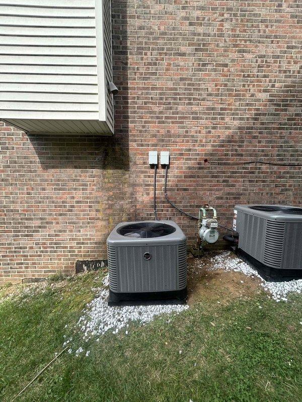 Completed full residential HVAC system installation for two-zone climate control. Second floor installation included RUUD RA14AY24BJ1NALHP 2-ton 15.2 SEER2 air conditioner, RCFY2414STAAMC evaporator coil, R801T0503A14UHSNAS 50,000 BTU 80% AFUE gas furnace, digital thermostat, and R8 foil duct insulation applied to both supply and return plenums. First floor/basement installation included RUUD RA14AY24BJ1NALHP 2-ton 15.2 SEER2 air conditioner, RCFY2417STANMC evaporator coil, R801T0754A17UHSNAS 75,000 BTU 80% AFUE gas furnace, and digital thermostat. Removed and properly disposed of all existing equipment from both zones. Installed three outdoor condenser units on white gravel pads against exterior brick wall with proper clearances and leveling. Ran refrigerant lines, electrical connections, and condensate drains per manufacturer specifications and local code requirements. Completed all gas line connections to furnaces with pressure testing for leak verification. Installed electrical dis