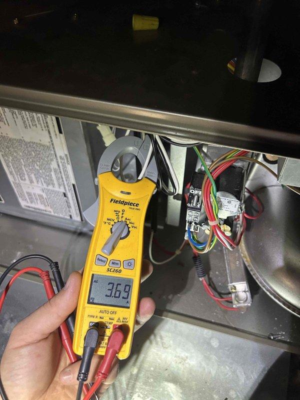 Completed preventive maintenance tune-up on heat pump and air handler system located in attic space with pulldown access. Performed comprehensive inspection of ductwork components, verified proper installation and connections of metal ductwork system, and noted normal operational wear with minor dust accumulation. Conducted electrical diagnostics using clamp meter, recording amperage reading of 36.9 amps on system components, and inspected all wiring connections, circuit breakers, and electrical components for proper operation and safety compliance. Customer-supplied 14x20x1 filter noted for system specifications.