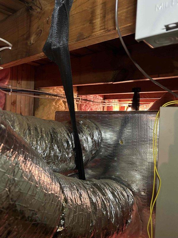 Completed comprehensive Care Plan tune-up service on dual HVAC system consisting of heat pump air handler located in attic and air conditioning gas furnace unit in basement. Performed thorough inspection and maintenance on outdoor condenser unit positioned at exterior of residence, noting weathered cabinet with surface accumulation and vegetation encroachment requiring clearance attention. Conducted full system evaluation of attic-mounted air handler, inspecting flexible ductwork with insulation jacketing, copper refrigerant lines, electrical connections, and condensate drainage components. Verified proper operation of both systems, checked refrigerant pressures, tested electrical components, inspected blower assemblies, and ensured all safety controls functioned correctly. Customer provided filters for installation per service agreement. Both HVAC systems operational and performing within manufacturer specifications upon completion of preventive maintenance service.