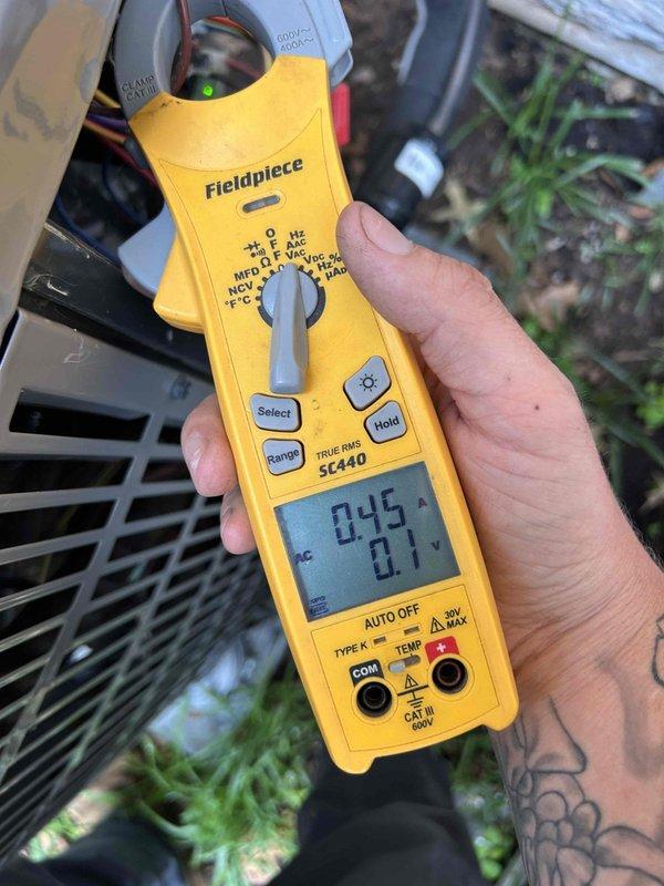 Performed comprehensive annual maintenance on Club Trio system consisting of three heat pump/gas furnace units—two located in basement and one in attic. Conducted complete AC tune-up on all three outdoor units, measuring electrical amperage and verifying proper operation using clamp meter. Inspected ductwork and recorded supply air temperatures at 60°F in attic unit, confirming adequate cooling performance. All systems operating within normal parameters with no deficiencies noted on this one-year-old equipment.