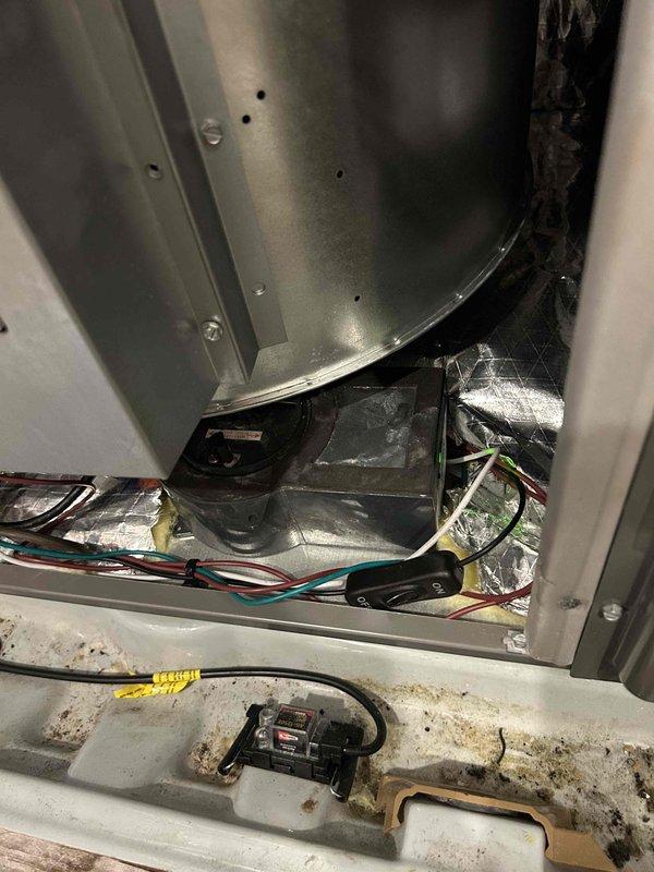Performed warranty follow-up inspection on recent HVAC installation. Coordinated with installation supervisor regarding necessary improvements to ductwork support system, including installation of additional duct straps and plenum reinforcement to ensure proper structural integrity. Reconnected Air Breeze ventilation unit to complete system integration. Documented existing condensate drain pan condition showing deterioration and rust staining, as well as ceiling-mounted ventilation component installation. All warranty items addressed to ensure system operates according to manufacturer specifications.