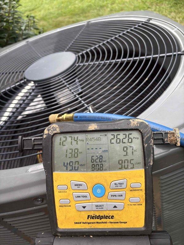 Completed full HVAC system replacement with installation of Trane 14.3 SEER2 heat pump system in attic, including 5TWR4036A100 outdoor condensing unit, 5TEM4B04AC31 air handler, and BAYHTR1510B backup heat strip. Removed and properly disposed of existing equipment per code compliance requirements. Installed outdoor unit on pad with proper clearances and secured all refrigerant line sets and electrical connections. Mounted air handler in attic with appropriate supports and drainage provisions. Ran new refrigerant lines with proper insulation and installed exterior disconnect box with conduit on brick wall exterior. Pulled vacuum on refrigerant system and performed leak test to verify system integrity. Charged system to manufacturer specifications and verified proper refrigerant pressures and temperatures using digital manifold gauges. Tested all electrical connections, verified proper amperage draw, and confirmed heat pump operation in both heating and cooling modes. Checked airflow, te