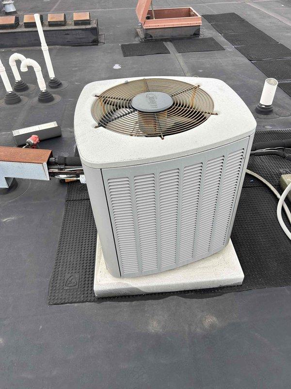 Responded to service call for residential air conditioning system blowing warm air. Upon arrival, located rooftop-mounted condenser unit model XC13-018-230-01. Performed diagnostic evaluation of system components including compressor operation, refrigerant pressures, electrical connections, and airflow through condenser coils. Identified and resolved issue causing loss of cooling capacity, restoring system to normal operating parameters with proper temperature differential across evaporator coil.