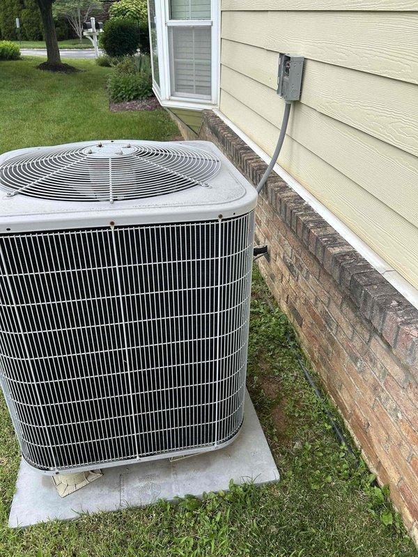 Responded to after-hours no cooling call on electric air conditioning system with indoor air handler located in attic. Upon arrival, performed complete system diagnostic on aging HVAC equipment. Inspected outdoor condensing unit positioned on concrete pad at exterior of residence, noting unit condition and operational status. Evaluated indoor air handler unit mounted in attic space, examining electrical connections, refrigerant lines, condensate drainage system including PVC piping configuration, and ductwork connections. Checked system components for proper operation, assessed refrigerant levels, tested electrical circuits and contactors, and verified airflow through supply and return ductwork. Identified root cause of cooling failure and presented repair options to restore system functionality. System evaluated for age-related component wear and overall operational efficiency.