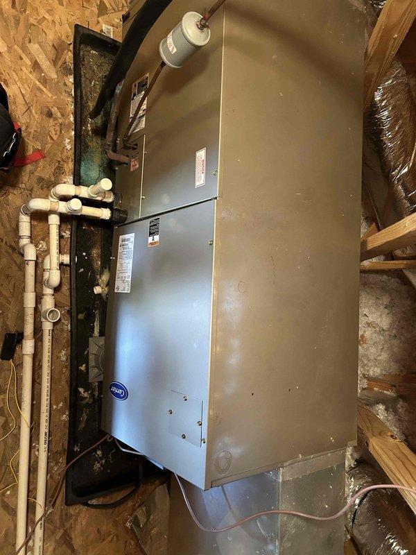 Responded to after-hours no cooling call on electric air conditioning system with indoor air handler located in attic. Upon arrival, performed complete system diagnostic on aging HVAC equipment. Inspected outdoor condensing unit positioned on concrete pad at exterior of residence, noting unit condition and operational status. Evaluated indoor air handler unit mounted in attic space, examining electrical connections, refrigerant lines, condensate drainage system including PVC piping configuration, and ductwork connections. Checked system components for proper operation, assessed refrigerant levels, tested electrical circuits and contactors, and verified airflow through supply and return ductwork. Identified root cause of cooling failure and presented repair options to restore system functionality. System evaluated for age-related component wear and overall operational efficiency.