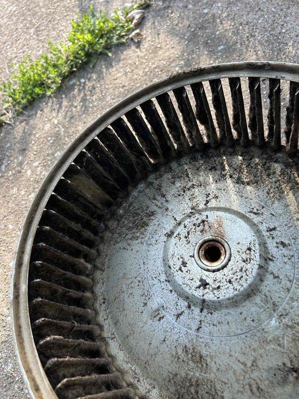 Replaced failed blower motor and performed thorough cleaning of heavily contaminated blower wheel and secondary heat exchanger. The blower wheel exhibited extensive accumulation of dust, dirt, and debris that had significantly impacted system airflow and efficiency. All components were cleaned, new motor installed, and system restored to proper operation.