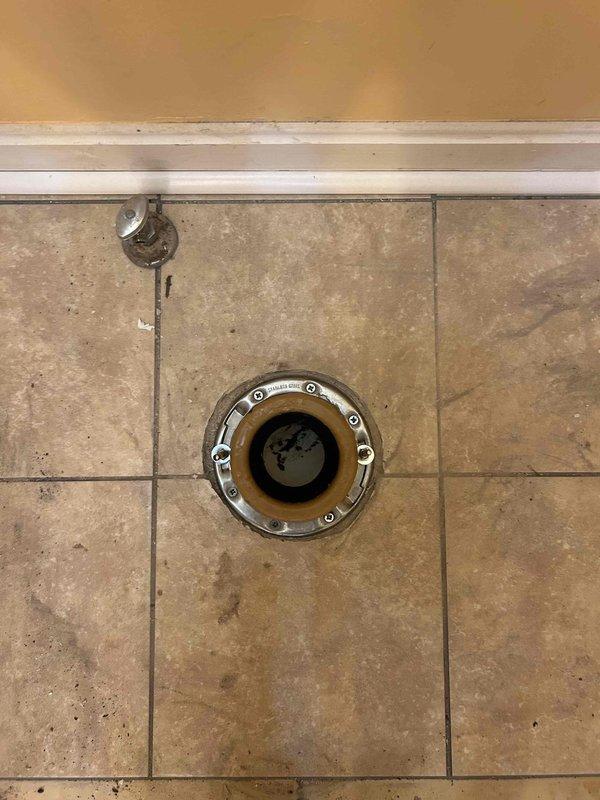 Successfully installed shower piping and completed rough-in work. Upon inspection, discovered the toilet flange area has compromised subfloor due to water damage and rot, preventing secure mounting of the flange and toilet installation. The wax ring and drain connection are prepared, but structural integrity of the flooring must be addressed before proceeding. Will return at no additional charge once flooring replacement is completed to properly secure the flange and set the toilet.