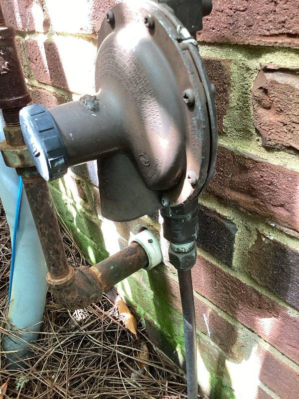 Completed electrical site assessment for propane-powered backup generator installation at residential property. Evaluated existing electrical service panel and meter configuration, documented current Milbank meter base with Blue Grass Energy metering equipment mounted on brick exterior, and assessed propane gas meter location and proximity to proposed generator placement. Identified circuit breaker panel capacity requirements and determined necessary electrical infrastructure modifications to accommodate automatic transfer switch and generator connection. Provided comprehensive estimate for complete generator installation including dedicated propane fuel line integration, proper electrical disconnects, and required circuit breaker upgrades to support backup power system.