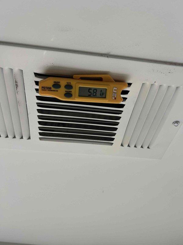 Responded to no cooling complaint on 7-year-old electric HVAC system with issue occurring since previous night. Performed diagnostic evaluation of outdoor unit and electrical components. Inspected electrical disconnects and conduit connections at exterior installation. Measured supply air temperature at vent register, recording 58.16°F output. Assessed system performance and airflow delivery. Noted air filter maintenance interval at 4-5 months since last replacement, which may impact system efficiency and cooling capacity.