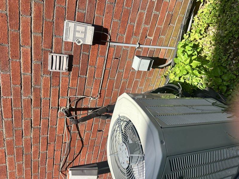 Responded to no cooling call on a 7-year-old electric HVAC system. Evaluated outdoor condensing unit located on brick patio and attic-mounted air handler with associated ductwork. Provided comprehensive replacement estimate for complete system including outdoor condenser unit and indoor evaporator coil assembly due to system failure.