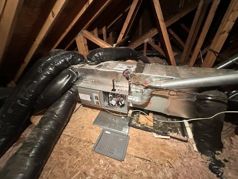 Responded to no cooling call on a 7-year-old electric HVAC system. Evaluated outdoor condensing unit located on brick patio and attic-mounted air handler with associated ductwork. Provided comprehensive replacement estimate for complete system including outdoor condenser unit and indoor evaporator coil assembly due to system failure.
