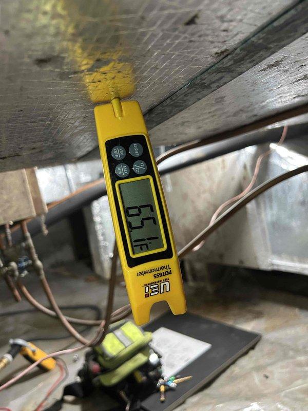 Responded to no heat call on 4-year-old geothermal electric system with indoor unit located in crawlspace. Upon arrival, performed system diagnostics and measured supply air temperature at 55°F, indicating inadequate heating output. Checked system pressures using calibrated gauges on the geothermal heat pump unit and found refrigerant pressures below manufacturer specifications. Inspected ground loop connections, reversing valve operation, and compressor function. Identified low refrigerant charge as primary cause of heating deficiency. Added refrigerant to proper levels per manufacturer specifications, verified proper system pressures, and confirmed adequate heat output. Cycled system through multiple heating cycles to ensure proper operation and temperature differential. System restored to normal heating operation with appropriate supply air temperatures achieved.