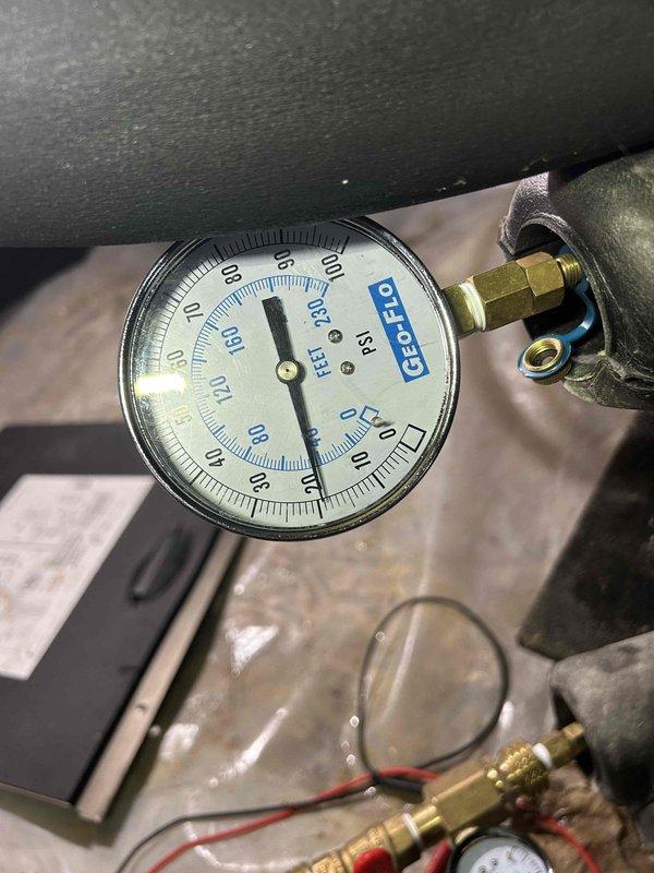 Responded to no heat call on 4-year-old geothermal electric system with indoor unit located in crawlspace. Upon arrival, performed system diagnostics and measured supply air temperature at 55°F, indicating inadequate heating output. Checked system pressures using calibrated gauges on the geothermal heat pump unit and found refrigerant pressures below manufacturer specifications. Inspected ground loop connections, reversing valve operation, and compressor function. Identified low refrigerant charge as primary cause of heating deficiency. Added refrigerant to proper levels per manufacturer specifications, verified proper system pressures, and confirmed adequate heat output. Cycled system through multiple heating cycles to ensure proper operation and temperature differential. System restored to normal heating operation with appropriate supply air temperatures achieved.