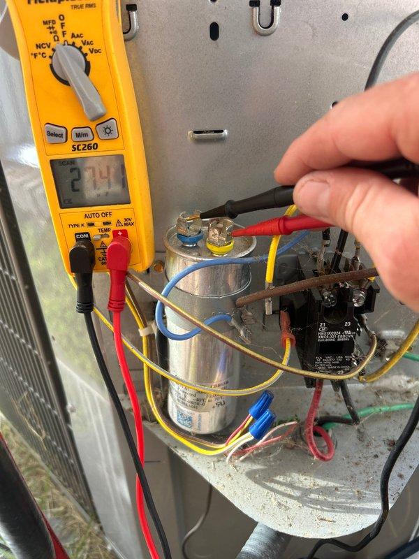 Completed routine tune-up on 15-year-old air conditioning system with no reported issues. Performed comprehensive system diagnostics including electrical testing of capacitor and contactor using calibrated multimeter, measuring voltage and electrical performance of critical components. All electrical connections, capacitor values, and relay operation tested within manufacturer specifications; system operating normally with no deficiencies found.