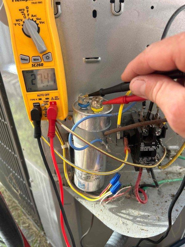 Completed routine tune-up on 15-year-old air conditioning system with no reported issues. Performed comprehensive system diagnostics including electrical testing of capacitor and contactor using calibrated multimeter, measuring voltage and electrical performance of critical components. All electrical connections, capacitor values, and relay operation tested within manufacturer specifications; system operating normally with no deficiencies found.
