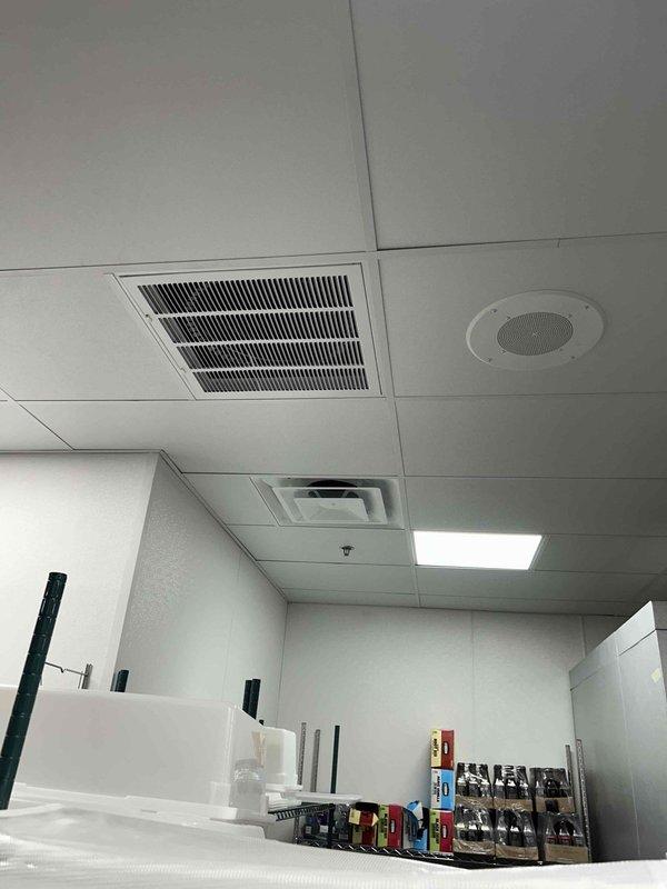 Returned to site to perform air balancing on HVAC duct system. Addressed issue with back return vents located behind kitchen area that were accumulating grease buildup, which was affecting system airflow and performance. Inspected ceiling-mounted return grilles and adjusted system to optimize air distribution throughout the commercial space.