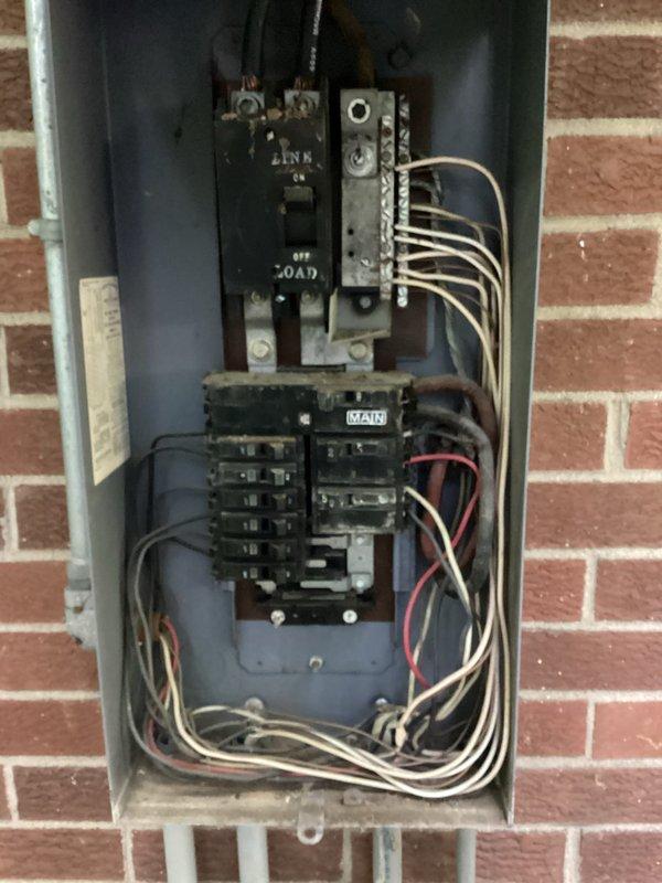 Performed comprehensive electrical assessment for portable generator hookup installation at residential property. Inspected existing electrical service and identified obsolete Stab-Lok panel requiring replacement due to known safety concerns and code compliance issues. Evaluated current panel configuration, main disconnect, branch circuit capacity, and existing wiring conditions. Documented aging electrical infrastructure including cloth-insulated conductors and weathered components. Prepared estimate for complete generator interlock or transfer switch installation, potential service panel upgrade to modern load center with appropriate amperage rating, and assessment of service entrance capacity to support additional generator load. Recommended full panel replacement to ensure safe and compliant portable generator connection.