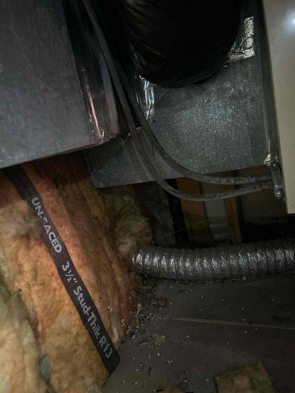 Responded to service call for 20-year-old heat pump system with complete loss of cooling affecting entire home. Performed comprehensive system evaluation of outdoor condensing unit and indoor air handler components. Inspected aging equipment including compressor, refrigerant lines, electrical connections, and ductwork system in attic space. Documented current system configuration with exterior unit positioned on ground-level pad and flexible duct distribution throughout conditioned space. Due to advanced age of equipment and complete system failure, provided detailed replacement estimate for new heat pump installation to restore climate control functionality.