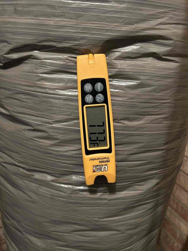 Responded to no cooling complaint on 7-year-old electric heat pump system serving lobby area. Upon arrival, found space temperature at 77°F with thermostat set to 72°F and unit blowing warm air. Indoor unit located in utility closet within large garage area, outdoor unit positioned at back of building. Performed diagnostic testing using digital manifold gauges and temperature probes on rooftop unit. Measured refrigerant pressures and temperatures at suction and liquid lines. Supply air temperature reading confirmed warm air discharge at 77.3°F from insulated ductwork. System showed inadequate cooling capacity and inability to meet thermostat setpoint demand.