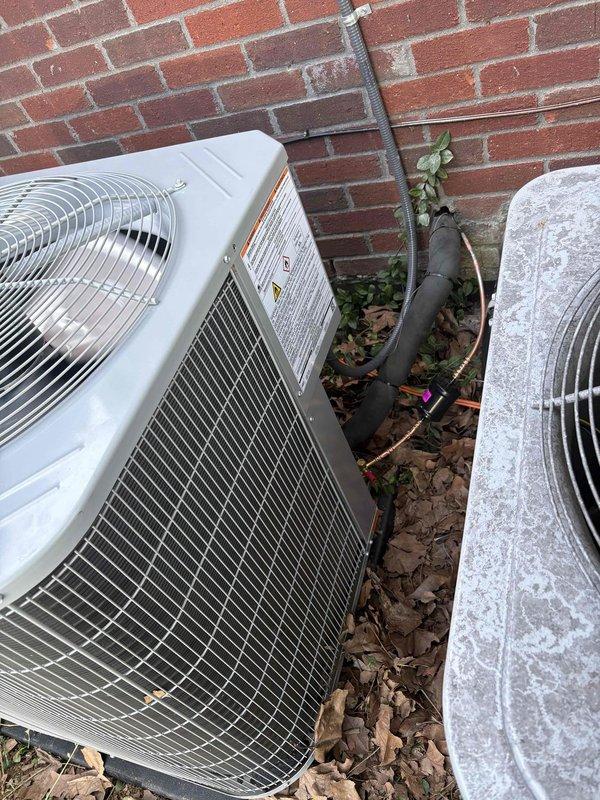 Completed full residential HVAC system installation including Bryant 70,000 BTU 80% efficiency single-stage gas furnace (model 800SB036070M14), Bryant 2-ton 14.3 SEER2 single-stage air conditioning condenser unit (model GA5SAN024), and Bryant 2-ton evaporator coil (model CVAMA2414) with digital thermostat. Removed and disposed of existing equipment, obtained necessary permits, installed all components to code compliance standards, ran refrigerant lines along exterior brick wall with proper insulation and mounting brackets, positioned outdoor condenser unit against building with adequate clearance, and completed all electrical and gas connections. System tested and operational with one-year labor warranty, ten-year parts warranty, and lifetime heat exchanger warranty provided.