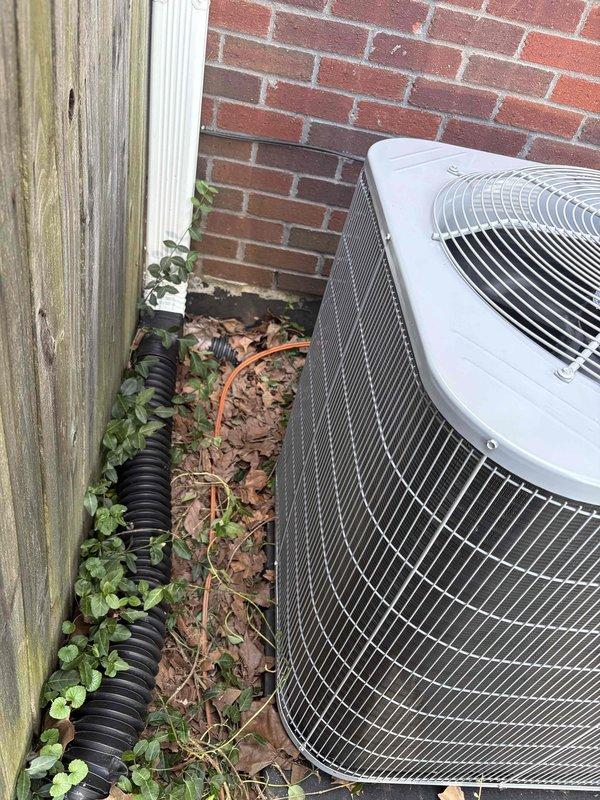 Completed full residential HVAC system installation including Bryant 70,000 BTU 80% efficiency single-stage gas furnace (model 800SB036070M14), Bryant 2-ton 14.3 SEER2 single-stage air conditioning condenser unit (model GA5SAN024), and Bryant 2-ton evaporator coil (model CVAMA2414) with digital thermostat. Removed and disposed of existing equipment, obtained necessary permits, installed all components to code compliance standards, ran refrigerant lines along exterior brick wall with proper insulation and mounting brackets, positioned outdoor condenser unit against building with adequate clearance, and completed all electrical and gas connections. System tested and operational with one-year labor warranty, ten-year parts warranty, and lifetime heat exchanger warranty provided.