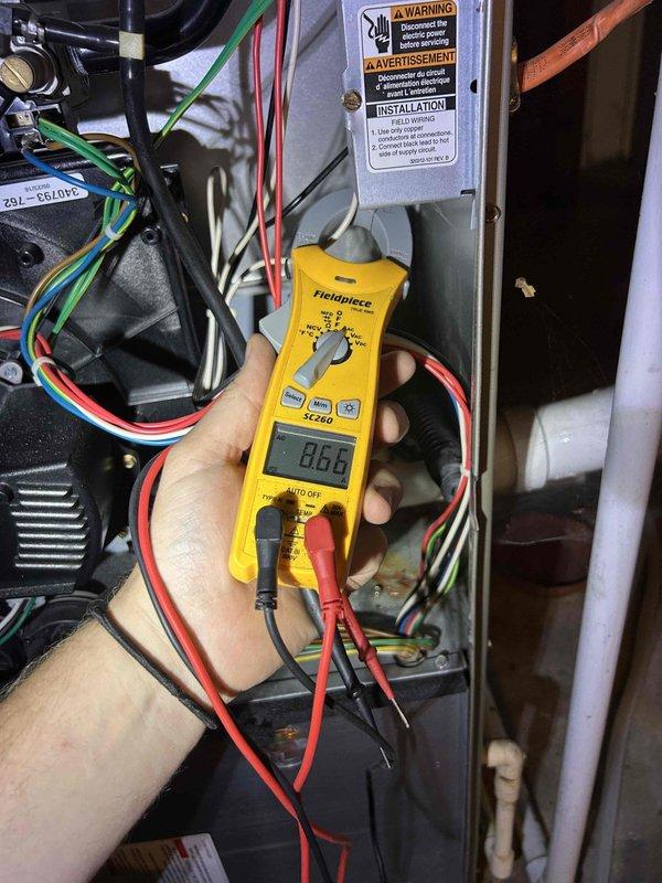 Responded to no-cool complaint on 10-year-old Carrier air conditioning system affecting entire home. Upon arrival, contacted customer prior to service as requested and gained property access. Performed diagnostic testing on outdoor condensing unit experiencing short-cycling behavior where system would run briefly then shut down. Utilized digital multimeter to measure electrical values at various system components and assessed ductwork dimensions at air handler. Indoor blower fan operational but compressor failing to maintain run cycle. Conducted complete system evaluation, documented findings with diagnostic photos, and provided customer with repair assessment along with replacement quote given age and condition of equipment.