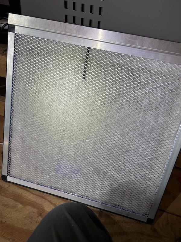 Responded to no cooling complaint on 18-year-old electric HVAC system with indoor unit located upstairs. Upon arrival, performed diagnostic testing of electrical components using clamp meter, measuring amperage draw at 0.93 amps in the condensing unit's electrical compartment. Inspected dual capacitor configuration and associated wiring connections for proper operation. Checked air filter condition at return vent, which appeared clean and unobstructed. System evaluated for age-related component wear and operational efficiency given extended service life beyond typical equipment lifespan.