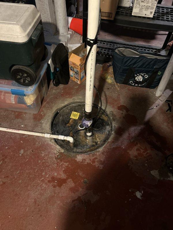Replaced failed sump pump unit and deteriorated plastic pit cover in 100-year-old residential property. Removed existing pump assembly, installed new submersible sump pump with integrated float switch, and connected discharge piping using PVC fittings. Secured new pit cover to prevent debris accumulation and ensure proper system operation while maintaining accessibility for future maintenance.