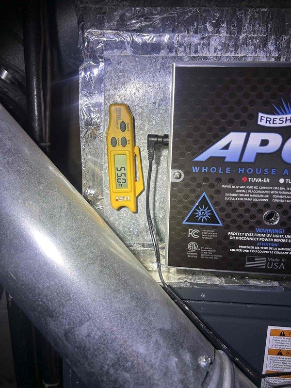 # HVAC Service Call - No Cooling Condition

Responded to a no cooling complaint on a 7-year-old residential air conditioning system. Upon arrival, performed system diagnostics to identify the cause of failure. Utilized digital temperature measurement equipment to assess operational parameters and verify system performance metrics.

Inspected the indoor air handler unit and associated components in the mechanical space. Documented equipment conditions including the APCO whole-house air purification system installation. Recorded manufacturer information from unit nameplate for U.S. Air/Accol equipment to verify model and serial number for service records.

Measured supply air temperatures using calibrated digital thermometer, recording readings of 305°F which indicated abnormal operating conditions requiring immediate attention. Evaluated ductwork, air handler cabinet, and ancillary equipment for proper operation. System diagnostics completed and photographic documentation captured for s