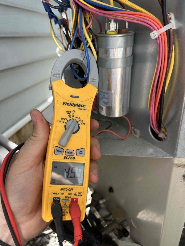 # HVAC Service Call - Bryant System Not Cooling Adequately

Responded to service call for Bryant residential air conditioning system experiencing inadequate cooling performance. Unit was cooling but unable to maintain desired temperature setpoint.

Upon arrival, performed visual inspection of outdoor condensing unit. Confirmed Bryant condenser in operational condition with no obvious physical damage or obstructions to airflow. Electrical disconnect and line set connections appeared secure.

Accessed electrical control panel within condensing unit to perform diagnostic testing. Using clamp meter, measured current draw on compressor circuit, which registered 14 amps. Inspected run capacitor for proper specifications and physical condition. Evaluated all wire connections including common, run, and start terminals for tightness and signs of overheating or deterioration.

Checked capacitor microfarad rating against manufacturer specifications to determine if component was operating within a