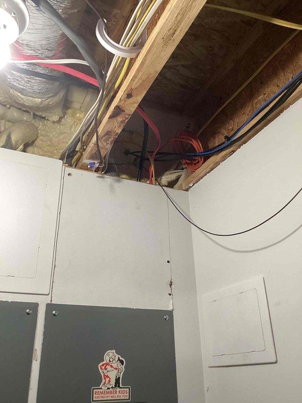 Successfully installed a complete Friedrich 18,000 BTU ductless mini-split system in the garage, consisting of a FAHFW18A3D Floating Air indoor unit and FPHSR18A3D outdoor condenser. Ran a new dedicated electrical circuit from the main panel to power the system, with the outdoor unit positioned on the right side of the small walkway deck. All work completed to code compliance standards with applicable permits obtained, including proper disposal of packaging materials.