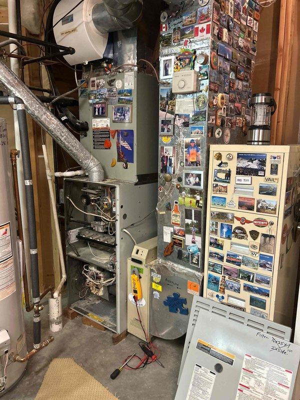Responded to service call for non-functioning air conditioning system with no cooling output on a five-year-old unit. Performed comprehensive diagnostic evaluation of the HVAC system, including inspection of the indoor air handler and furnace assembly located in the basement mechanical room. Opened access panels to examine internal components, blower motor assembly, electrical connections, and wiring. Utilized electronic testing equipment to measure voltage, amperage, and system performance parameters. Inspected refrigerant line sets, copper piping connections, and ductwork for proper installation and potential issues. Assessed the condition of both indoor and outdoor equipment to determine system viability. Based on diagnostic findings and age of equipment, provided detailed estimate for complete system replacement including new air conditioning unit, air handler, and associated components to restore cooling functionality to the residence.