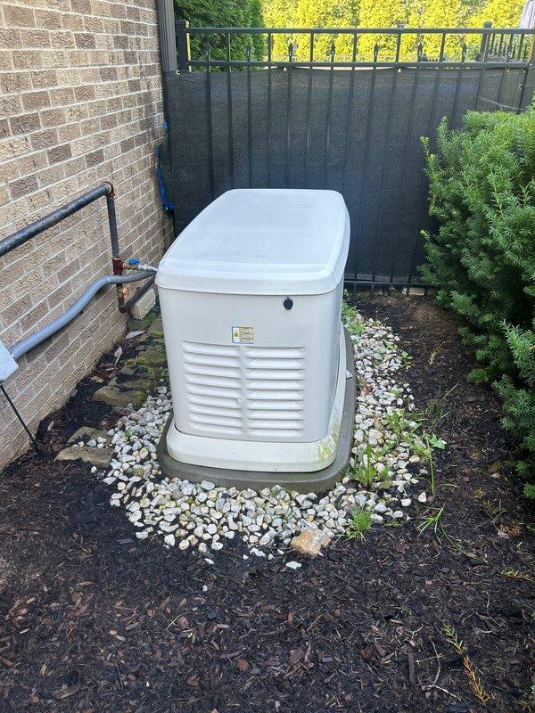 Completed annual HVAC maintenance and AC tune-up on a two-and-a-half-year-old residential air conditioning system. System was inspected and serviced per manufacturer specifications with no issues or deficiencies noted. Unit is operating within normal parameters and residential standby generator installation area was observed to be in good condition with proper clearances maintained.