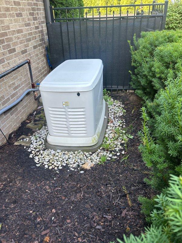 Completed annual HVAC maintenance and AC tune-up on a two-and-a-half-year-old residential air conditioning system. System was inspected and serviced per manufacturer specifications with no issues or deficiencies noted. Unit is operating within normal parameters and residential standby generator installation area was observed to be in good condition with proper clearances maintained.