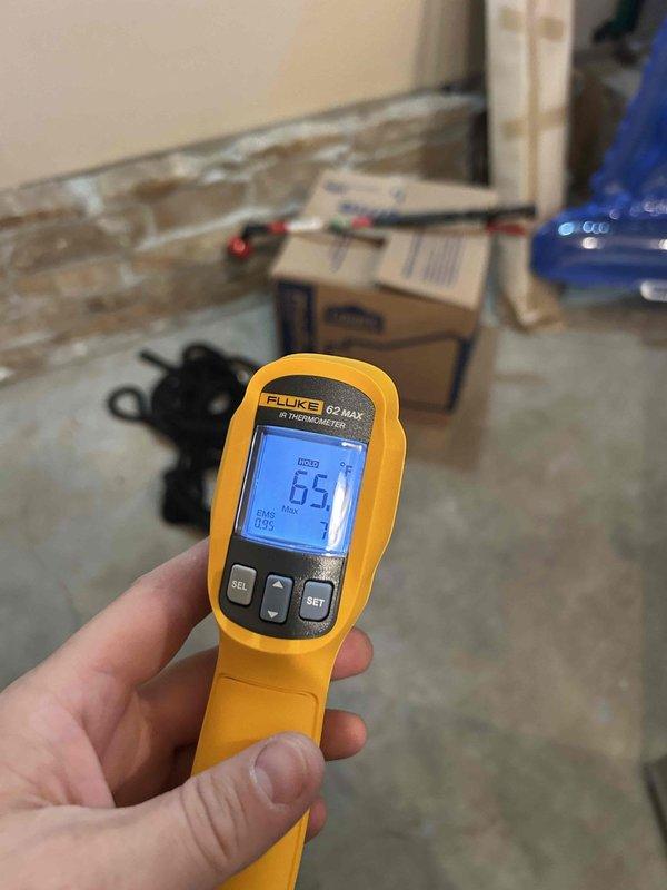 Responded to no cooling complaint on heat pump system located in laundry room. Performed diagnostic testing on air handler unit using infrared thermometer and multimeter to measure supply air temperature and verify electrical component operation. Supply air temperature measured at 65°F, indicating insufficient cooling capacity. Conducted electrical diagnostics at control board, measuring microamp readings at 5.28 to verify proper signal communication between components. Inspected wiring connections, control module, and relay operation within equipment panel. System evaluation completed with diagnostic findings documented for recommended repairs.