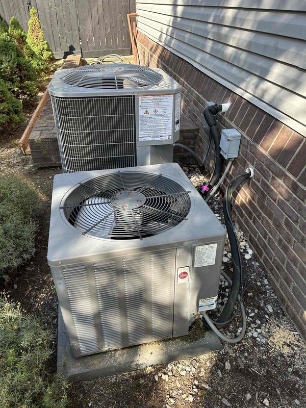 Responded to service call for downstairs unit failing to maintain temperature, with indoor conditions reaching 80°F. Upon arrival, inspected both outdoor condensing units and measured supply air temperature at floor register reading 54.3°F, indicating inadequate cooling performance from the aging system. Documented equipment condition and discussed performance issues with occupant regarding the 10+ year old unit's diminished capacity to keep up with cooling demand.